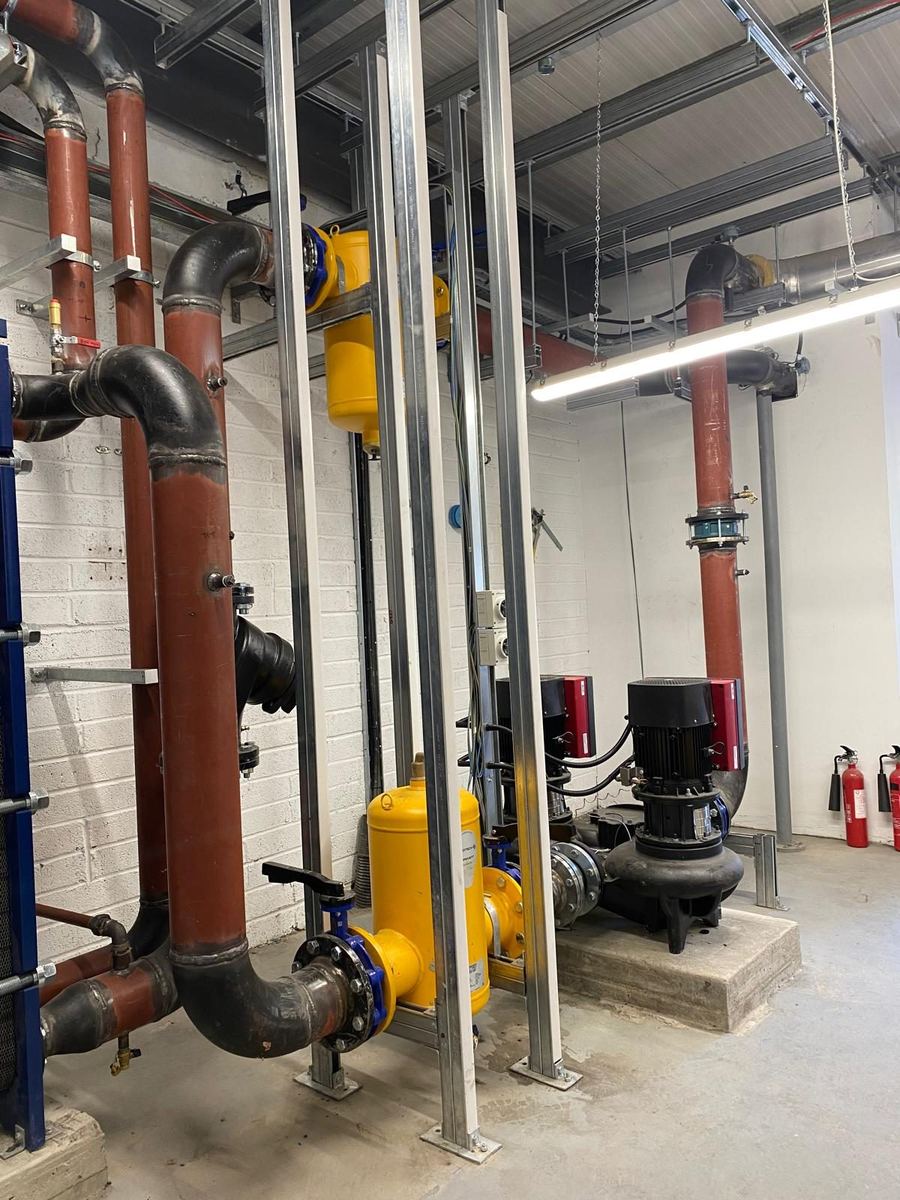 Copper risers, gas service and pump set in a commercial plant room