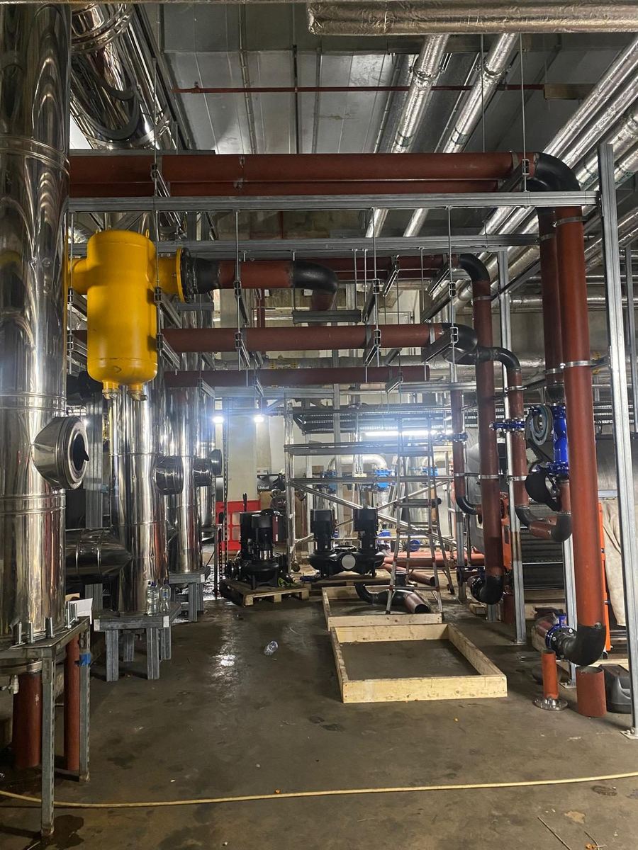 Wide view of a live plant room installation in progress
